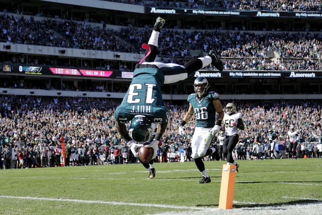 Philadelphia Eagles' Josh Huff flips into the end zone for a touchdown during the first half of an NFL football game against the New Orleans Saints, Sunday, Oct. 11, 2015, in Philadelphia. (AP Photo/Matt Rourke)