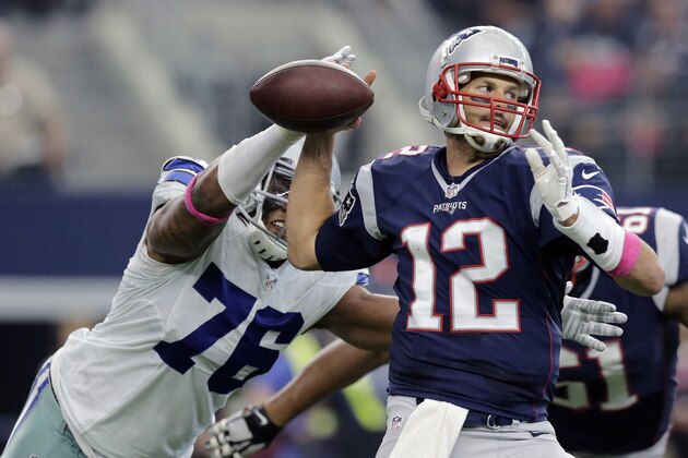 New England Patriots' Tom Brady (12) is pressured by Dallas Cowboys' Greg Hardy (76) during the first quarter of an NFL football game, Sunday, Oct. 11, 2015, in Arlington, Texas. (AP Photo/Tim Sharp)