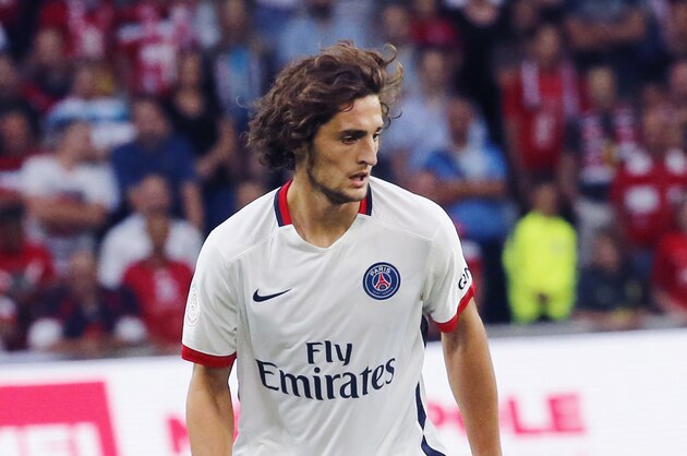 Paris Saint Germain's  Adrien Rabiot control the ball during his French League one soccer match against Lille at the Lille Metropole stadium, in Villeneuve d'Ascq, northern France, Friday, Aug. 7, 2015.(AP Photo/Jacques Brinon)