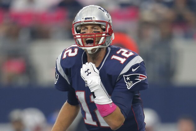New England Patriots' Tom Brady (12) calls a play during the first quarter of an NFL football game against the Dallas Cowboys, Sunday, Oct. 11, 2015, in Arlington, Texas. (AP Photo/Brandon Wade)