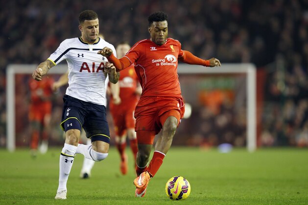 Liverpool's Daniel Sturridge, right, battles for the ball with Tottenham's Kyle Walker during the English Premier League soccer match between Liverpool and Tottenham Hotspur at Anfield Stadium, Liverpool, England, Tuesday Feb. 10, 2015. (AP Photo/Jon Super)
