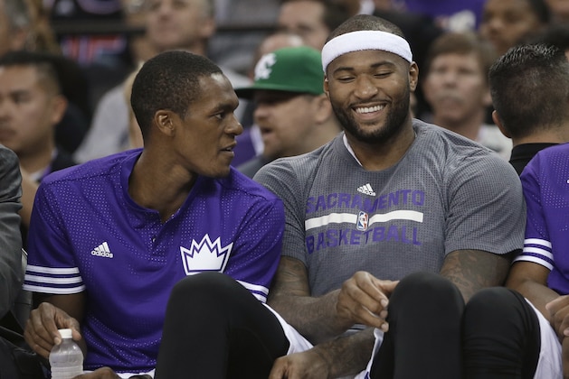 Sacramento Kings' Rajon Rondo, left and DeMarcus Cousins relax on the bench during the second half of an NBA preseason basketball game against the San Antonio Spurs in Sacramento, Calif., Thursday, Oct. 8, 2015. The Kings won 95-92. (AP Photo/Rich Pedroncelli)