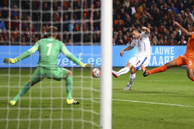 Pavel Kaderabek of the Czech Republic, center, scores his side’s first goal passing Netherlands' goalkeeper Jeroen Zoet, left, and Netherlands' Jairo Riedewald, right, during the Euro 2016 qualifying match between the Netherlands and the Czech Republic, at the ArenA stadium, in Amsterdam, Netherlands, Tuesday, Oct. 13, 2015. (AP Photo/Peter Dejong)