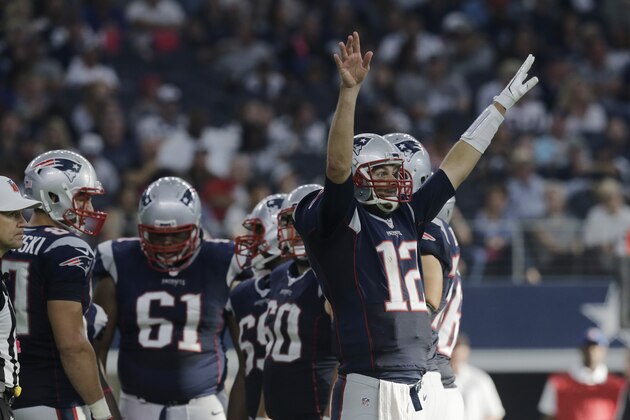 New England Patriots' Tom Brady (12) signals during the second half of an NFL football game against the Dallas Cowboys, Sunday, Oct. 11, 2015, in Arlington, Texas. (AP Photo/Tim Sharp)