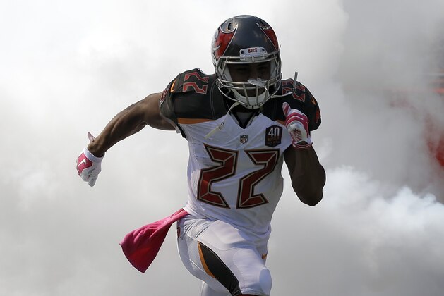 Tampa Bay Buccaneers running back Doug Martin (22) runs onto the field during team introductions before an NFL football game Jacksonville Jaguars Sunday, Oct. 11, 2015, in Tampa, Fla. (AP Photo/Chris O'Meara)