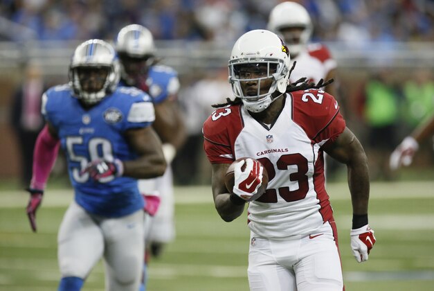 Arizona Cardinals running back Chris Johnson (23) is pursued by Detroit Lions middle linebacker Tahir Whitehead (59) during the first half of an NFL football game, Sunday, Oct. 11, 2015, in Detroit. (AP Photo/Duane Burleson)