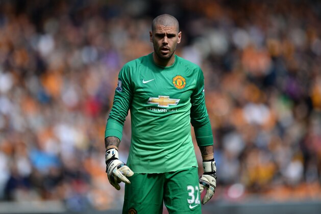 Manchester United's Spanish goalkeeper Victor Valdes plays during the English Premier League football match between Hull City and Manchester United at the KC Stadium in Kingston upon Hull, north east England on May 24, 2015.  AFP PHOTO / OLI SCARFF

RESTRICTED TO EDITORIAL USE. NO USE WITH UNAUTHORIZED AUDIO, VIDEO, DATA, FIXTURE LISTS, CLUB/LEAGUE LOGOS OR LIVE SERVICES. ONLINE IN-MATCH USE LIMITED TO 45 IMAGES, NO VIDEO EMULATION. NO USE IN BETTING, GAMES OR SINGLE CLUB/LEAGUE/PLAYER PUBLICATIONS.        (Photo credit should read OLI SCARFF/AFP/Getty Images)