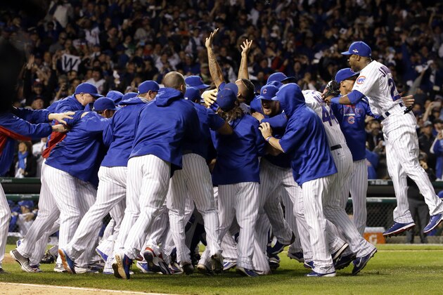 Chicago Cubs players celebrate after winning Game 4 in baseball's National League Division Series, Tuesday, Oct. 13, 2015, in Chicago. The Cubs won 4-6. (AP Photo/Nam Y. Huh)