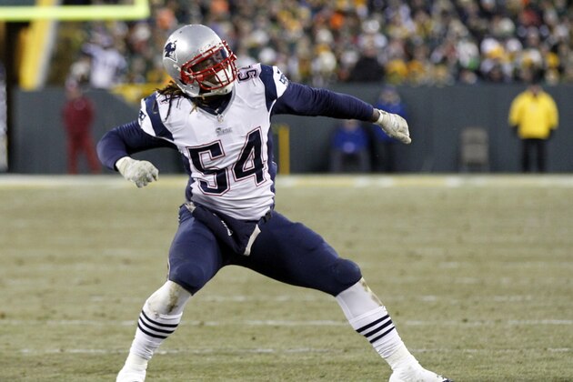 New England Patriots' Dont'a Hightower reacts after sacking Green Bay Packers quarterback Aaron Rodgers during the first half of an NFL football game Sunday, Nov. 30, 2014, in Green Bay, Wis. (AP Photo/Mike Roemer)