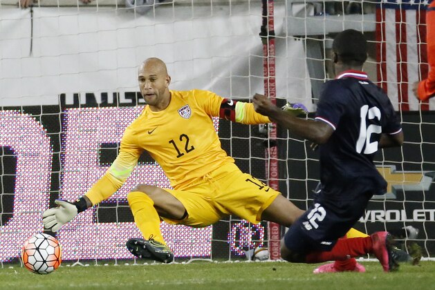 Costa Rica's Joel Campbell, right, scores a goal on United States goalkeeper  goalkeeper Tim Howard, left, during the second half of a international soccer friendly match, Tuesday, Oct. 13, 2015, in Harrison, N.J. (AP Photo/Julio Cortez)