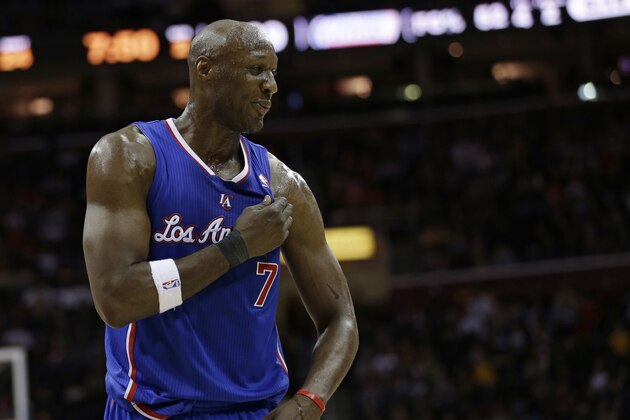 Los Angeles Clippers' Lamar Odom waits during a time-out during an NBA basketball game against the Cleveland Cavaliers Friday, March 1, 2013, in Cleveland. (AP Photo/Tony Dejak)