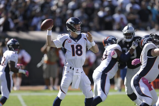 Denver Broncos quarterback Peyton Manning (18) passes against the Oakland Raiders during the first half of an NFL football game in Oakland, Calif., Sunday, Oct. 11, 2015. (AP Photo/Ben Margot)