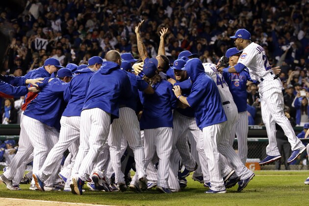 Chicago Cubs players celebrate after winning Game 4 in baseball's National League Division Series, Tuesday, Oct. 13, 2015, in Chicago. The Cubs won 4-6. (AP Photo/Nam Y. Huh)