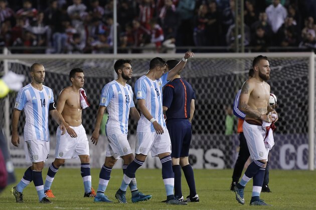 Argentina's players walk off the pitch at the end of a soccer 2018 World Cup qualifying match against Paraguay, in Asuncion, Paraguay, on Tuesday, October 13, 2015. The match ended in a 0-0 draw. (AP Photo/Cesar Olmedo ) Argentina's players walk off the pitch at the end of a soccer 2018 World Cup qualifying match against Paraguay, in Asuncion, Paraguay, on Tuesday, October 13, 2015. The match ended in a 0-0 draw. (AP Photo/Cesar Olmedo )