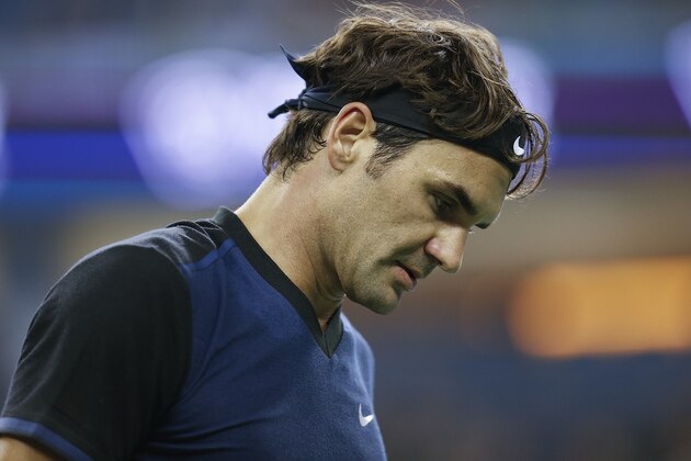 SHANGHAI, CHINA - OCTOBER 13:  Roger Federer of Switzerland reacts after losing the point against Albert Ramos-Vinolas of Spain during their men's singles second round match on day 3 of Shanghai Rolex Masters at Qi Zhong Tennis Centre on October 13, 2015 in Shanghai, China.  (Photo by Lintao Zhang/Getty Images)