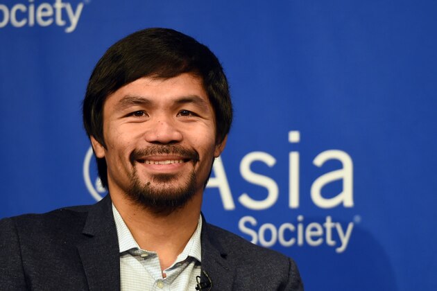 Boxer Manny Pacquiao holds a press conference after touring the Asia Society in New York on October 12, 2015. Pacquiao, who announced on October 5 that he will be running for senator in the 2016 Philippine general elections, is in town to receive Asia Society's 2015 Asia Game Changer of the Year Award, which recognizes those making a transformative and positive difference for the future of Asia and the world.    AFP PHOTO / TIMOTHY A. CLARY        (Photo credit should read TIMOTHY A. CLARY/AFP/Getty Images)