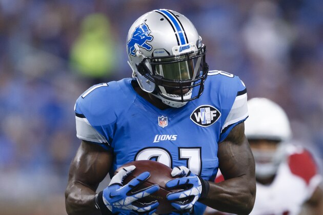 Detroit Lions wide receiver Calvin Johnson (81) passes the ball after making a reception against the Arizona Cardinals during an NFL football game at Ford Field in Detroit, Sunday, Oct. 11, 2015. (AP Photo/Rick Osentoski)