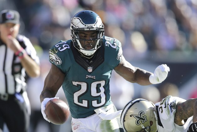 Philadelphia Eagles' DeMarco Murray, left, rushes against New Orleans Saints' Kenny Vaccaro during the second half of an NFL football game, Sunday, Oct. 11, 2015, in Philadelphia. (AP Photo/Matt Rourke)
