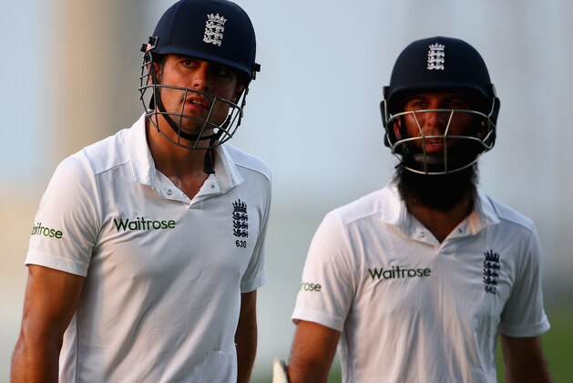 ABU DHABI, UNITED ARAB EMIRATES - OCTOBER 14:  Alastair Cook and  Moeen Ali of England leave the field after  Day Two of the First Test between Pakistan and England at Zayed Cricket Stadium on October 14, 2015 in Abu Dhabi, United Arab Emirates.  (Photo by Francois Nel/Getty Images)