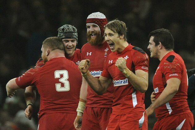 Wales' Liam Williams, 2nd right, celebrates with Jack Ball, 3rd right, after Wales beat South Africa 12-6 during the International Rugby Union match between Wales and South Africa at the Millennium Stadium, Cardiff, Wales, Saturday, Nov. 29, 2014. (AP Photo/Rui Vieira)