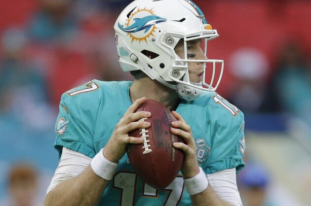 Miami Dolphins' Ryan Tannehill passes the ball during the NFL football game between the New York Jets and the Miami Dolphins and at Wembley stadium in London, Sunday, Oct. 4, 2015. (AP Photo/Matt Dunham)