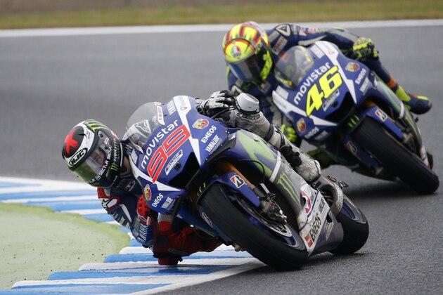 Spain's Jorge Lorenzo steers his Yamaha tailed by Italy's Valentino Rossi on Yamaha during the MotoGP Japanese Motorcycle Grand Prix at the Twin Ring Motegi circuit in Motegi, north of Tokyo,  Sunday, Oct.  11, 2015. (AP Photo/Shizuo Kambayashi)