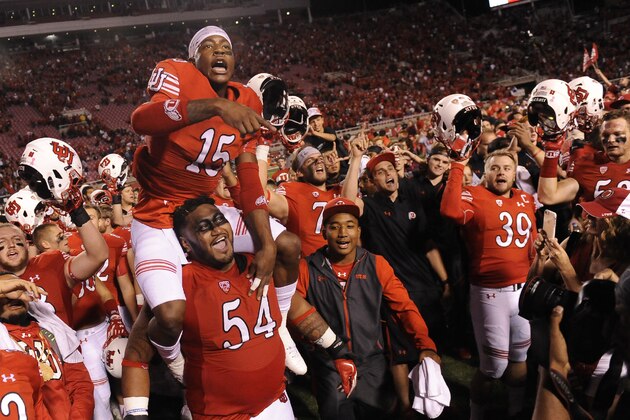 SALT LAKE CITY, UT - OCTOBER 10: Dominique Hatfield #15 of the Utah Utes on the shoulder of teammate Isaac Asiata #54 of the Utah Utes leads the team in celebration after their 30-24 win of California Golden Bears at Rice-Eccles Stadium on October 10, 2015 in Salt Lake City, Utah. (Photo by Gene Sweeney Jr/Getty Images)
