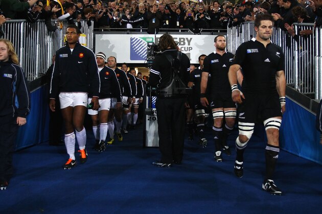 France's captain Thierry Dusautoir (L) and New Zealand All Blacks captain Richie McCaw (R) lead their teams ont the field during the 2011 Rugby World Cup final match New Zealand vs France at Eden Park Stadium in Auckland on October 23, 2011. AFP PHOTO / PHIL WALTER / POOL (Photo credit should read PHIL WALTER/AFP/Getty Images)