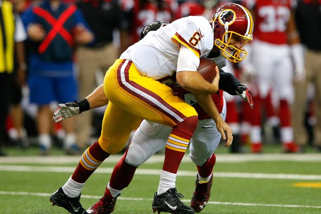 ATLANTA, GA - OCTOBER 11:  Kirk Cousins #8 of the Washington Redskins rushes against Nate Stupar #54 of the Atlanta Falcons at Georgia Dome on October 11, 2015 in Atlanta, Georgia.  (Photo by Kevin C. Cox/Getty Images)