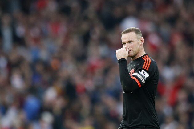 Manchester United's Wayne Rooney walks on the pitch following the end of the English Premier League soccer match between Arsenal and Manchester United at Emirates stadium in London, Sunday, Oct. 4, 2015. Arsenal won the match 3-0. (AP Photo/Frank Augstein)