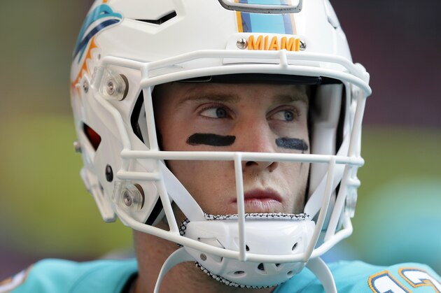 Miami Dolphins' Ryan Tannehill looks on as he warms-up before the NFL football game between the New York Jets and the Miami Dolphins and at Wembley stadium in London, Sunday, Oct. 4, 2015. (AP Photo/Tim Ireland)