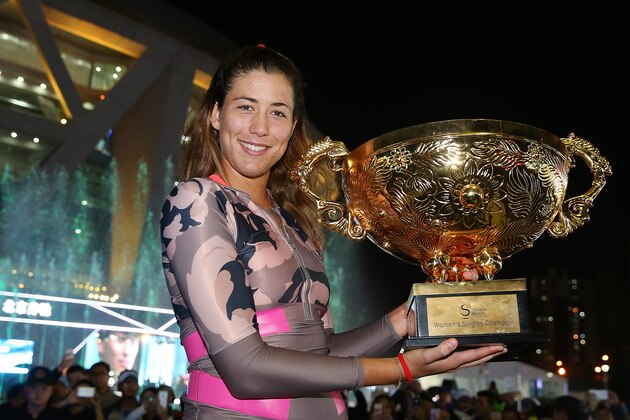 BEIJING, CHINA - OCTOBER 11:  Garbine Muguruza of Spain holds the winners trophy after winning the Womens Final against Timea Bacsinszky of Switzerland on day 9 of the 2015 China Open at the China National Tennis Centre on October 11, 2015 in Beijing, China.  (Photo by Chris Hyde/Getty Images)