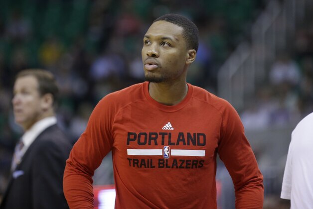 Portland Trail Blazers guard Damian Lillard looks on during the second quarter of an NBA preseason basketball game against the Utah Jazz Monday, Oct. 12, 2015, in Salt Lake City. (AP Photo/Rick Bowmer)