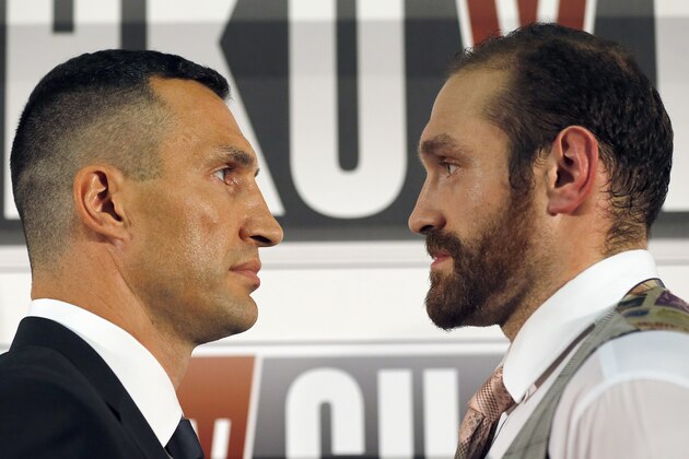 World Heavyweight boxing champion  Wladimir Klitschko, left, and British heavyweight Tyson Fury stare at each other  during a press conference in London, Wednesday, Sept. 23, 2015.  Klitschko will fight Fury in a heavyweight title bout on Oct. 24,  in Duesseldorf, Germany.(AP Photo/Frank Augstein)