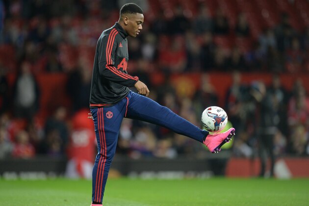 Manchester United's French midfielder Anthony Martial warms up ahead of the English League Cup third round football match between Manchester United and Ipswich Town at Old Trafford in Manchester, north west England on September 23, 2015. AFP PHOTO / OLI SCARFF

RESTRICTED TO EDITORIAL USE. No use with unauthorized audio, video, data, fixture lists, club/league logos or 'live' services. Online in-match use limited to 75 images, no video emulation. No use in betting, games or single club/league/player publications.        (Photo credit should read OLI SCARFF/AFP/Getty Images)