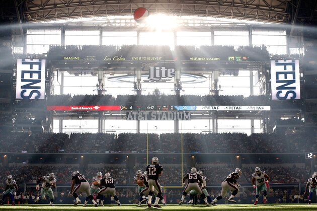 ARLINGTON, TX - OCTOBER 11:  Quarterback Tom Brady #12 of the New England Patriots drops back to pass during the second half of the NFL game against the Dallas Cowboys at AT&T Stadium on October 11, 2015 in Arlington, Texas.  The Patriots defeated the Cowboys 30-6.  (Photo by Christian Petersen/Getty Images)