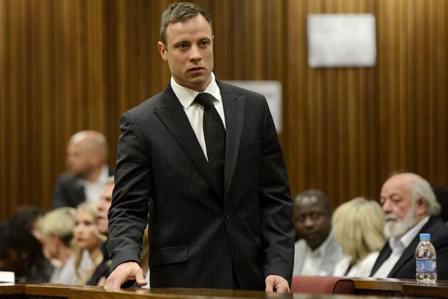 Oscar Pistorius arrives in court in Pretoria, South Africa, Tuesday, Oct. 21, 2014. Pistorius will finally learn his fate  when judge Thokozile Masipais is expected to announce the Olympic runner's sentence for killing girlfriend Reeva Steenkamp  (AP Photo/Herman Verwey, Pool)