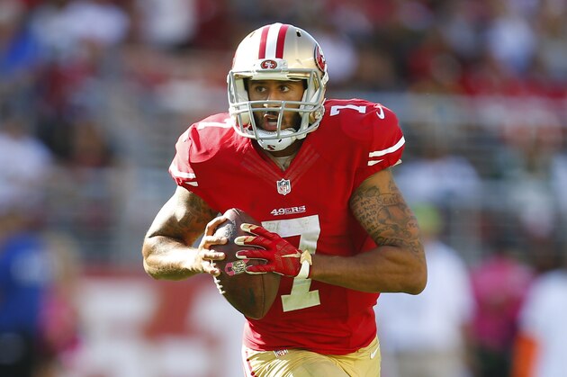 San Francisco 49ers quarterback Colin Kaepernick (7) runs with the ball against the Green Bay Packers during an NFL football game in Santa Clara, Calif., Sunday, Oct. 4, 2015. (Jeff Haynes/AP Images for Panini)