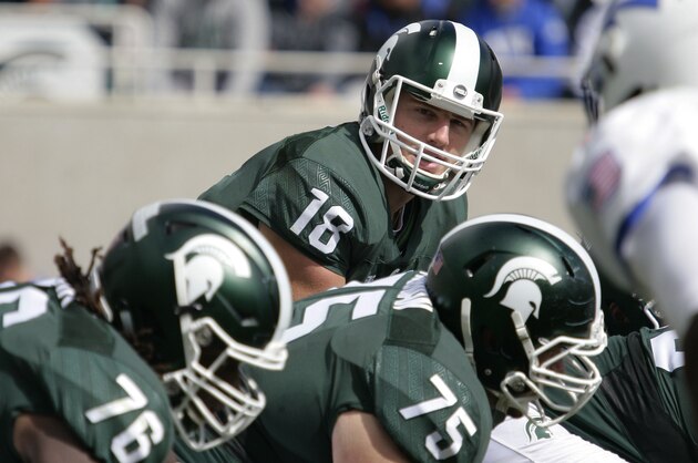 Michigan State quarterback Connor Cook (18) prepares to take a snap during an NCAA college football game against Air Force, Saturday, Sept. 19, 2015, in Spartan Stadium in East Lansing, Mich. (AP Photo/Al Goldis)