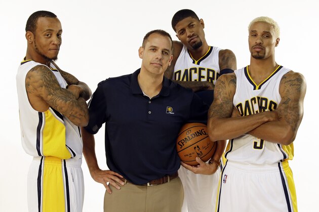 Indiana Pacers head coach Frank Vogel poses with Monta Ellis, left, Paul George and George Hill, right, during the team's NBA basketball media day, Monday, Sept. 28, 2015 in Indianapolis. (AP Photo/Darron Cummings)