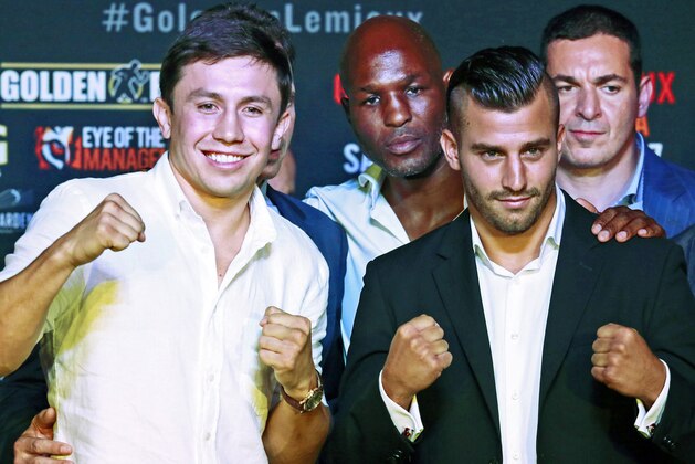 Gennady Golovkin, left, of Kazakhstan, and David Lemieux, of Canada, pose during a news conference to promote their upcoming middleweight championship boxing match Thursday, Aug. 20, 2015, in Los Angeles. Standing in back middle are Golden Boy promoter Bernard Hopkins, center, and Lemieux's manager, Camille Estephan. The fighters will meet Oct. 17, 2015 in New York. (AP Photo/Nick Ut)