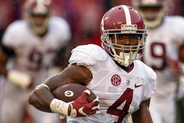 Oct 3, 2015; Athens, GA, USA; Alabama Crimson Tide defensive back Eddie Jackson (4) runs the ball for a touchdown after an interception during the third quarter against the Georgia Bulldogs at Sanford Stadium. Mandatory Credit: Dale Zanine-USA TODAY Sports