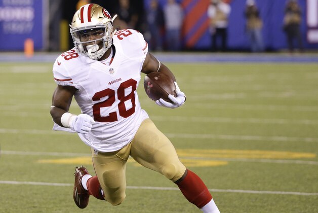 San Francisco 49ers running back Carlos Hyde (28) runs the ball against the New York Giants during the first quarter of an NFL football game, Sunday, Oct. 11, 2015, in East Rutherford, N.J. (AP Photo/Seth Wenig)