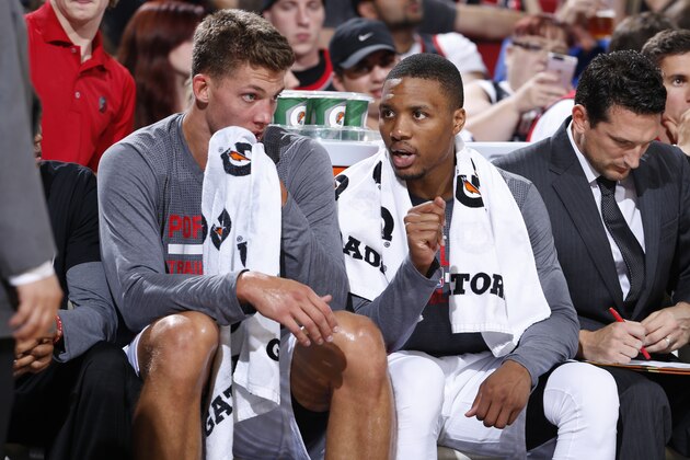 PORTLAND, OR - OCTOBER 5:  Meyers Leonard #11 and Damian Lillard #0 of the Portland Trail Blazers talk during the game against the Sacramento Kings on October 5, 2015 at the Moda Center Arena in Portland, Oregon. NOTE TO USER: User expressly acknowledges and agrees that, by downloading and or using this photograph, user is consenting to the terms and conditions of the Getty Images License Agreement. Mandatory Copyright Notice: Copyright 2015 NBAE (Photo by Sam Forencich/NBAE via Getty Images)