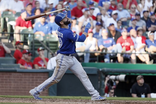 Toronto Blue Jays right fielder Jose Bautista (19) flies out against the Texas Rangers during the sixth inning in Game 4 of baseball's American League Division Series Monday, Oct. 12, 2015, in Arlington, Texas. (AP Photo/Tony Gutierrez)