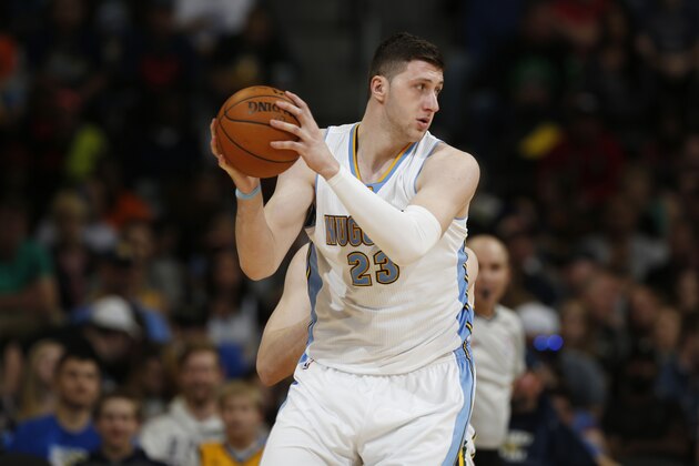 Denver Nuggets center Jusuf Nurkic, of Bosnia Herzegovina, looks to pass the ball against the Utah Jazz in the fourth quarter of an NBA basketball game Friday, March 27, 2015, in Denver. The Nuggets won 107-91. (AP Photo/David Zalubowski)