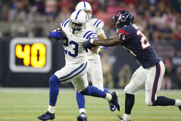 Oct 8, 2015; Houston, TX, USA; Indianapolis Colts running back Frank Gore (23) runs with the ball against Houston Texans cornerback Johnathan Joseph (24) in the first quarter at NRG Stadium. Mandatory Credit: Matthew Emmons-USA TODAY Sports