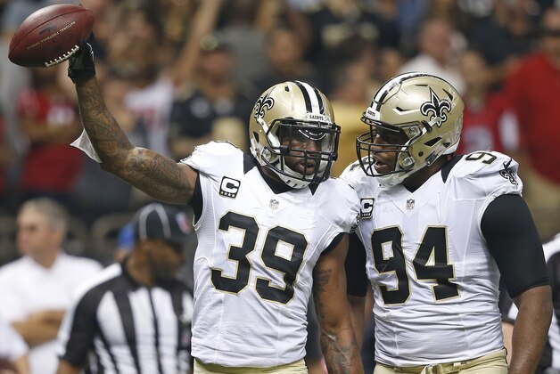 New Orleans Saints cornerback Brandon Browner (39) celebrates picking up a fumble with New Orleans Saints defensive end Cameron Jordan (94) during the first half of an NFL football game against the Atlanta Falcons, Thursday, Oct. 15, 2015, in New Orleans. (AP Photo/Gerald Herbert)