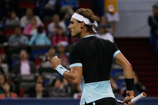 Rafael Nadal of Spain reacts after winning a set point against Milos Raonic of Canada during the Shanghai Masters tennis tournament in Shanghai, China, Thursday, Oct. 15, 2015. (AP Photo/Andy Wong)