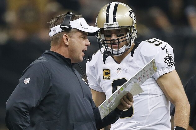 New Orleans Saints head coach Sean Payton speaks to New Orleans Saints quarterback Drew Brees (9) during the first half of an NFL football game against the Atlanta Falcons, Thursday, Oct. 15, 2015, in New Orleans. (AP Photo/Gerald Herbert)